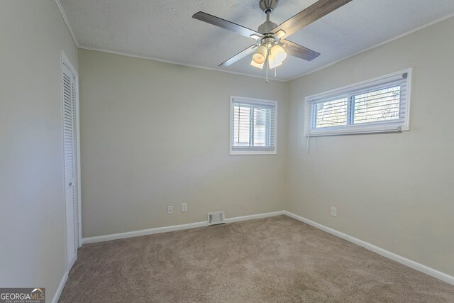 1883 La Mesa Ln, Decatur, GA 30032 - carpeted spare room featuring ornamental molding, ceiling fan, and a textured ceiling