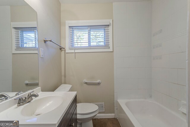 1883 La Mesa Ln, Decatur, GA 30032 - full bathroom with tile patterned floors, vanity, toilet, and tiled shower / bath combo