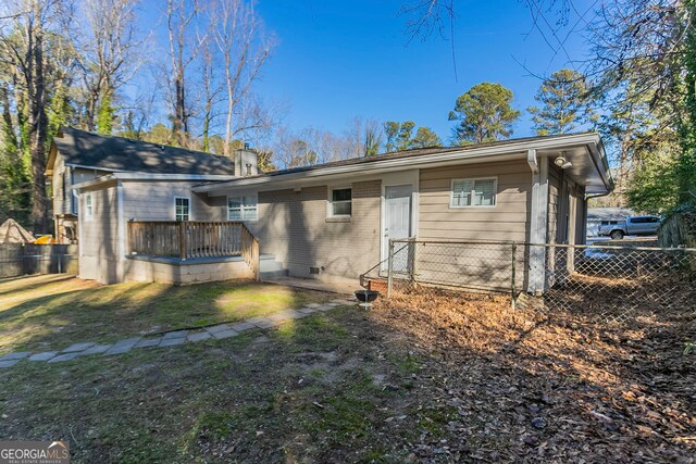 1883 La Mesa Ln, Decatur, GA 30032 - back of house with a lawn and a deck