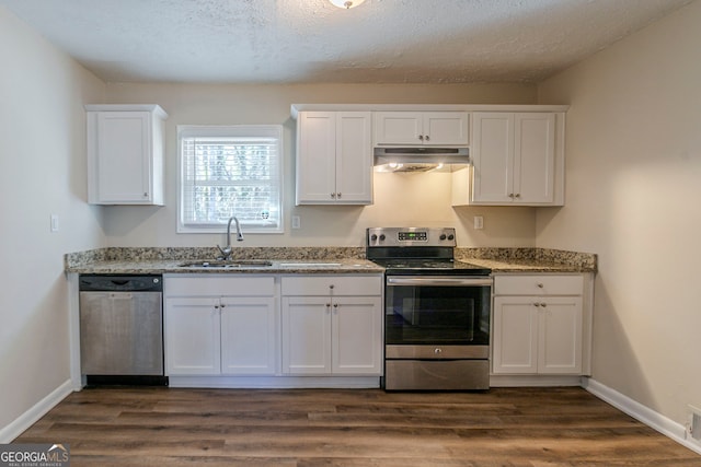 1883 La Mesa Ln, Decatur, GA 30032 - kitchen with white cabinetry, appliances with stainless steel finishes, dark wood-type flooring, and sink