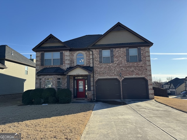 view of front of property with a garage