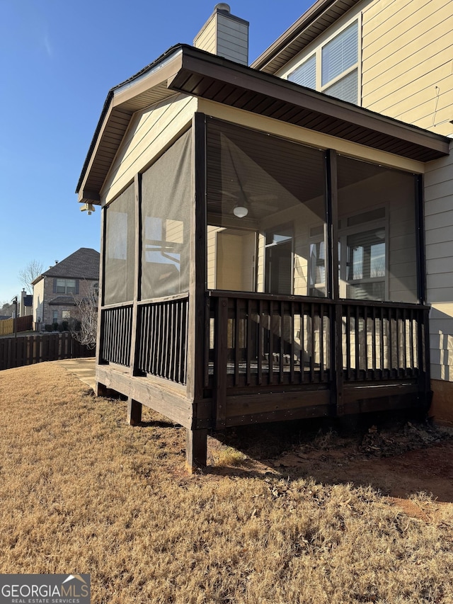 view of side of property with a sunroom