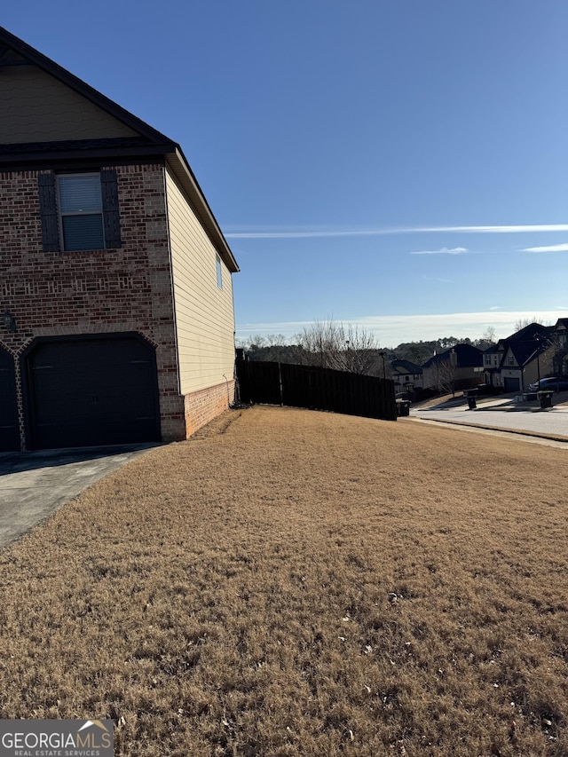 view of yard featuring a garage