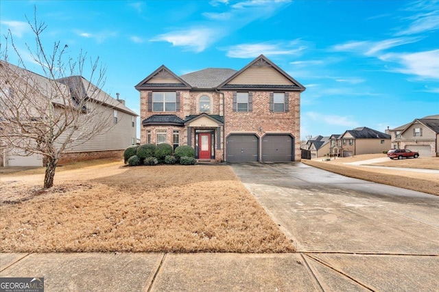 view of front facade with a garage and a front lawn