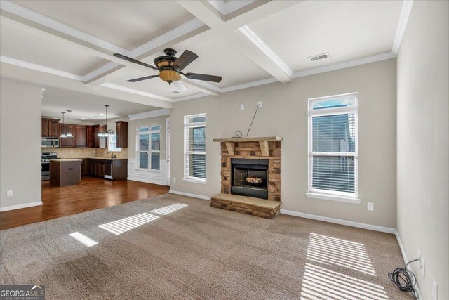 empty room featuring vaulted ceiling, carpet floors, and ceiling fan