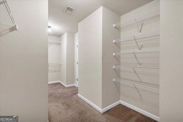 empty room with carpet and lofted ceiling