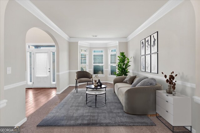 interior details with stainless steel fridge with ice dispenser, crown molding, dark brown cabinets, and dark hardwood / wood-style floors