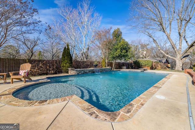 view of pool featuring pool water feature and a patio