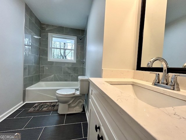 full bathroom featuring toilet, vanity, tile patterned flooring, and tiled shower / bath