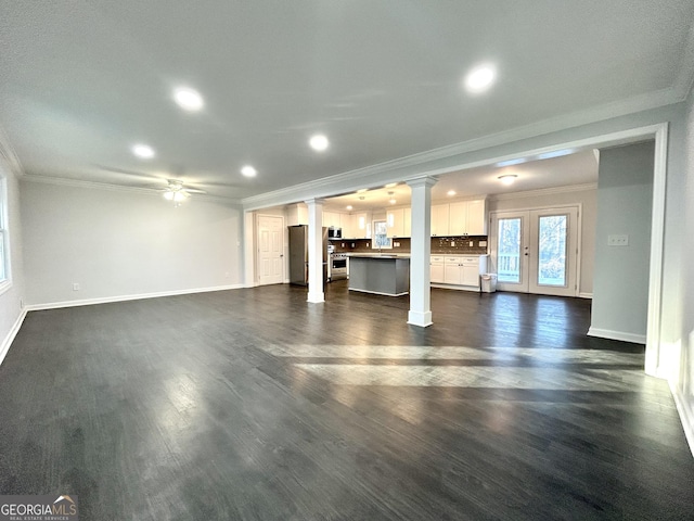 unfurnished living room featuring ceiling fan, french doors, dark hardwood / wood-style flooring, and ornamental molding