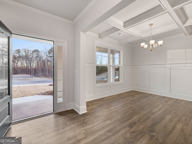 entrance foyer featuring an inviting chandelier, crown molding, beam ceiling, and coffered ceiling