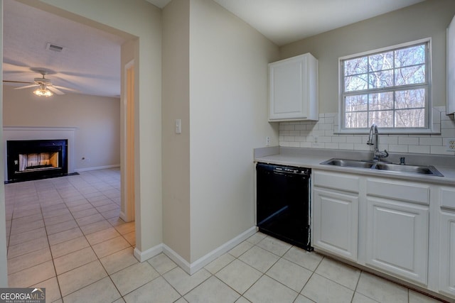 kitchen featuring sink, white cabinetry, dishwasher, and tasteful backsplash