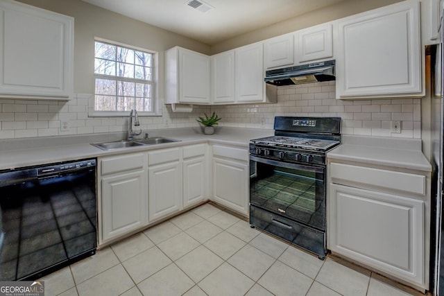 kitchen with light tile patterned floors, backsplash, black appliances, white cabinets, and sink