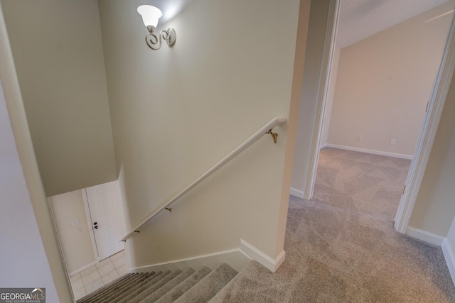 stairs featuring carpet