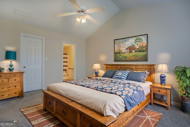 carpeted bedroom with ceiling fan, ensuite bathroom, and vaulted ceiling