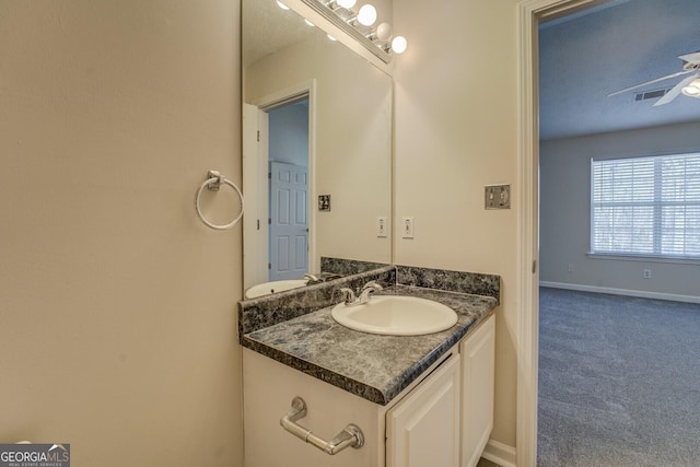 bathroom featuring ceiling fan and vanity