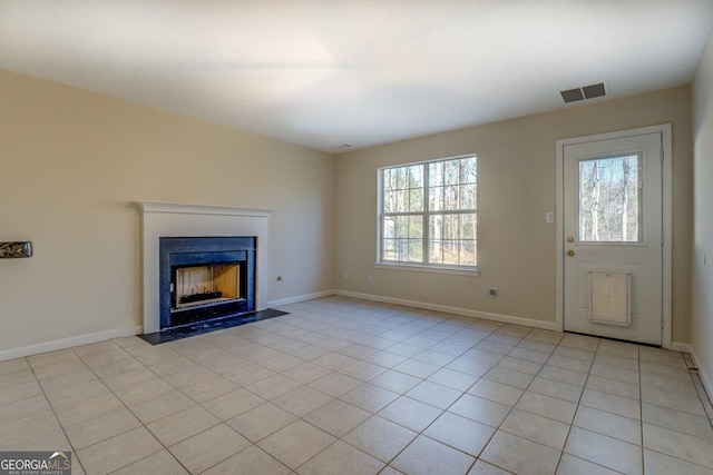 unfurnished living room featuring light tile patterned floors