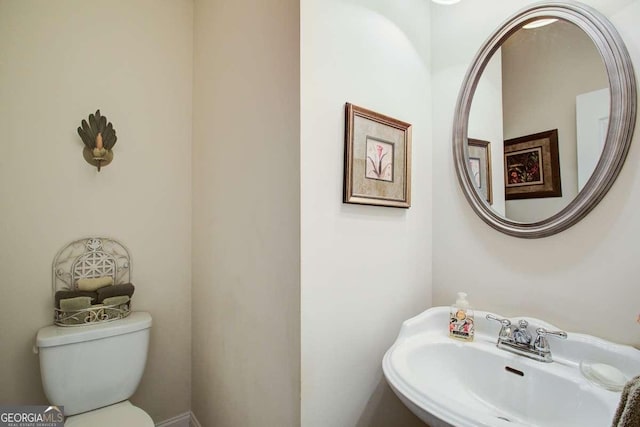 bathroom with sink and toilet