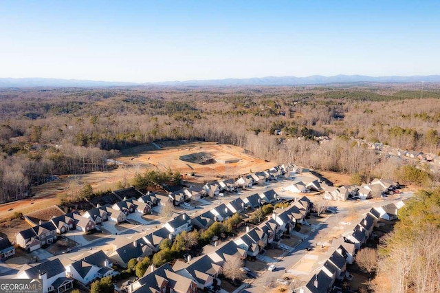 birds eye view of property featuring a mountain view