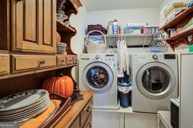 laundry area with separate washer and dryer