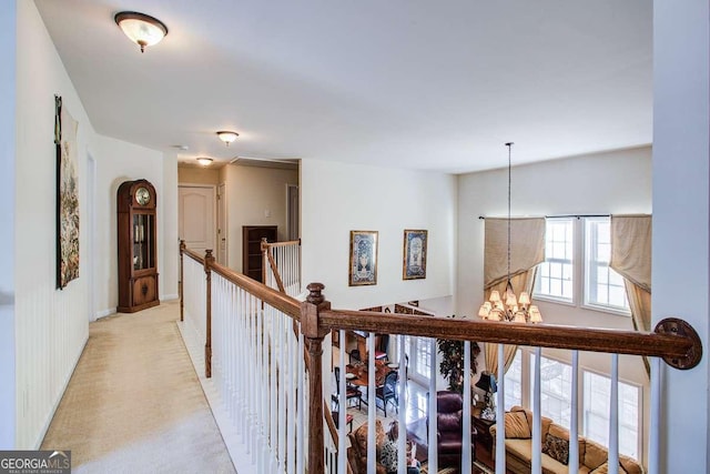 hall featuring a notable chandelier