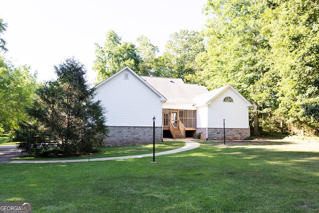 ranch-style home featuring a front yard