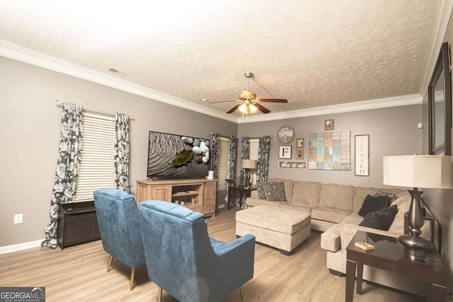 living room with a textured ceiling, ceiling fan, crown molding, and light hardwood / wood-style floors