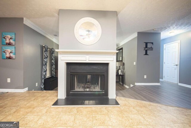 living room with hardwood / wood-style flooring, a textured ceiling, and crown molding