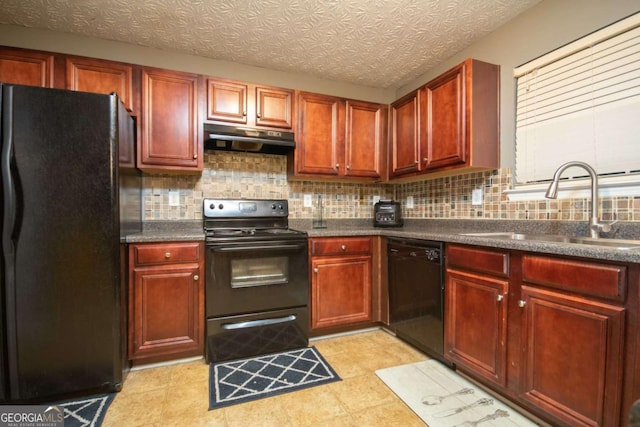 kitchen featuring a textured ceiling, decorative backsplash, sink, and black appliances