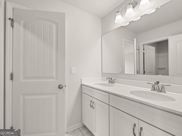 bathroom featuring tile patterned floors and vanity