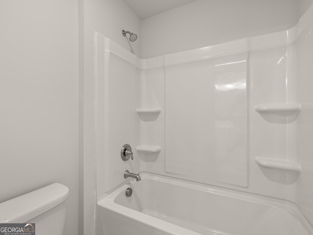 bathroom featuring toilet and shower / washtub combination