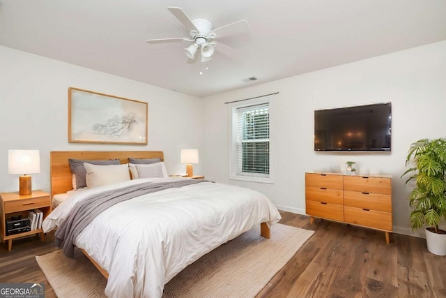 bedroom featuring ceiling fan and dark hardwood / wood-style flooring