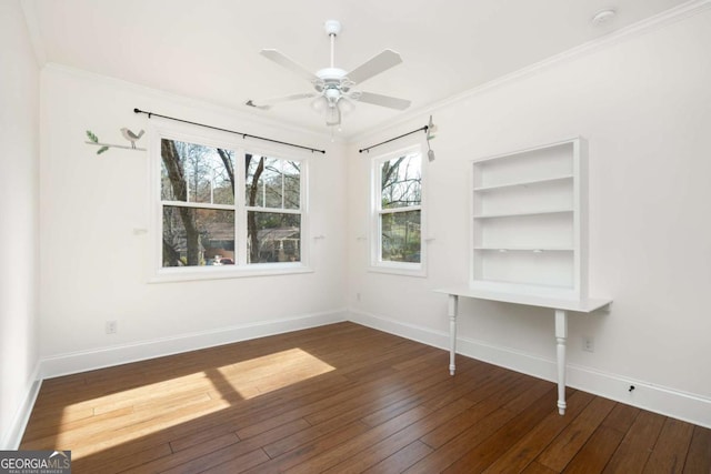 unfurnished room with ceiling fan, dark hardwood / wood-style floors, and ornamental molding