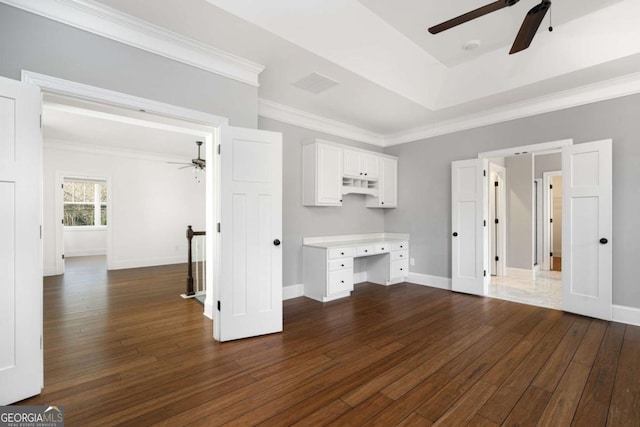 interior space featuring ceiling fan and dark hardwood / wood-style floors