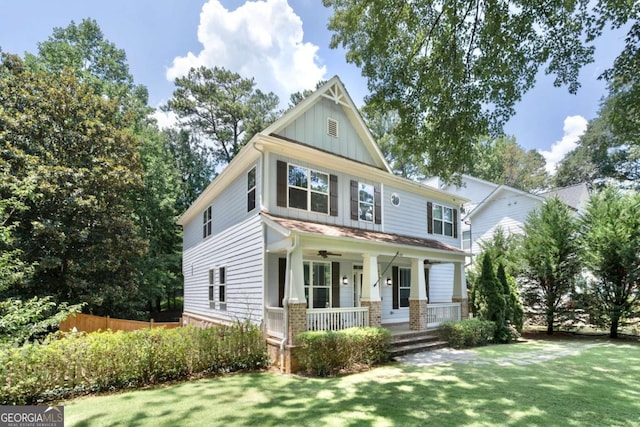 view of front of home with covered porch and a front yard