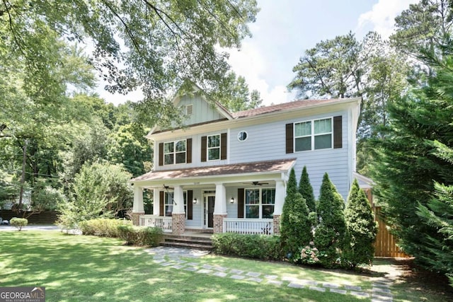 view of front facade with a front lawn and a porch