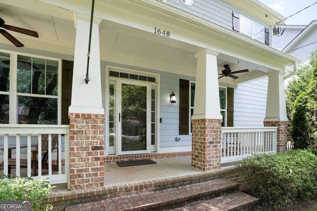 entrance to property featuring ceiling fan and covered porch