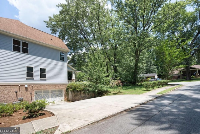 view of side of property featuring a garage