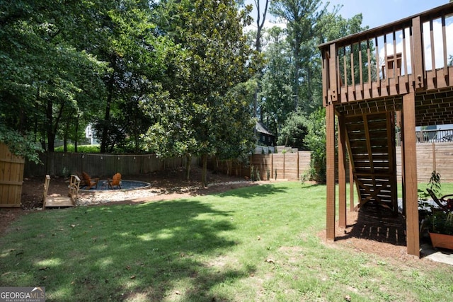 view of yard with an outdoor fire pit