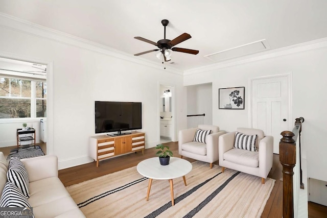 living room with ceiling fan, ornamental molding, and dark hardwood / wood-style floors