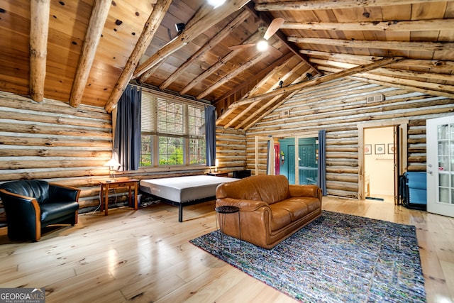 unfurnished room featuring beam ceiling, hardwood / wood-style floors, rustic walls, and wooden ceiling