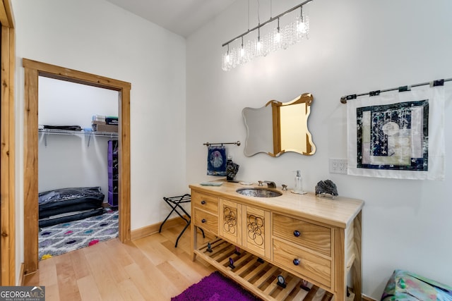 bathroom with hardwood / wood-style flooring and vanity