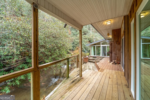 deck with a sunroom