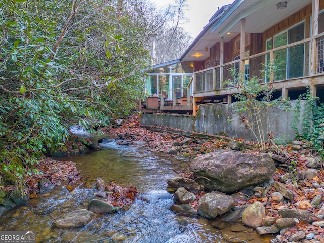 view of yard featuring a sunroom