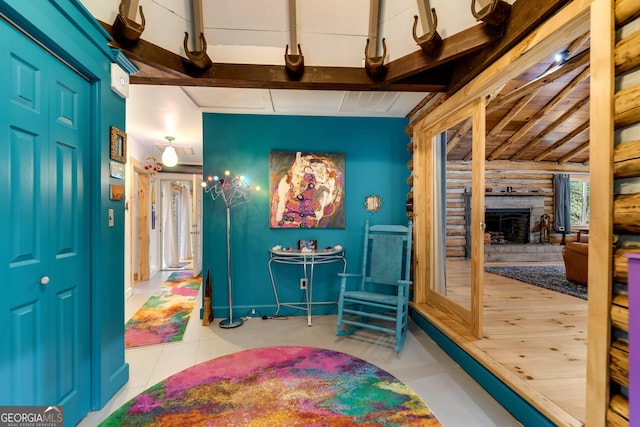 interior space featuring vaulted ceiling with beams