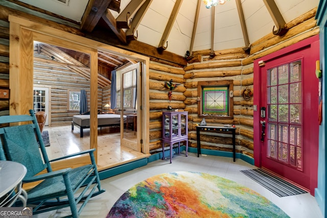 interior space featuring high vaulted ceiling, beamed ceiling, and rustic walls