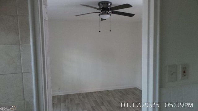 interior space with ceiling fan and hardwood / wood-style floors