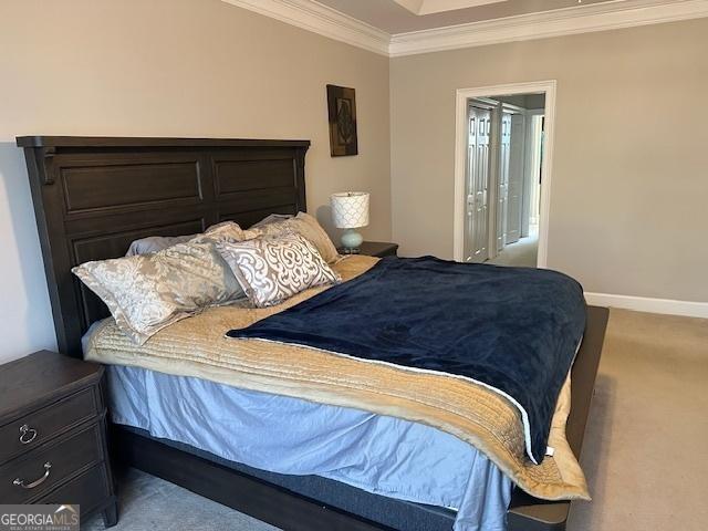 carpeted bedroom featuring ornamental molding