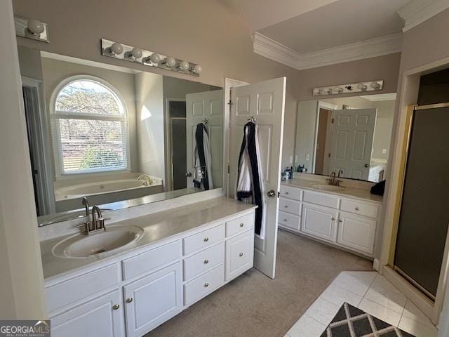 bathroom featuring shower with separate bathtub, tile patterned floors, and vanity