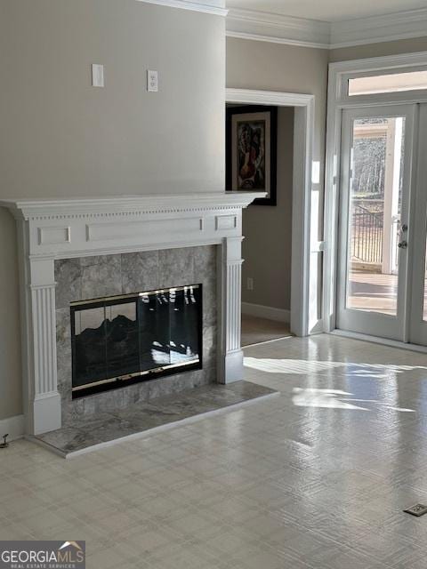 unfurnished living room featuring ornamental molding and a fireplace